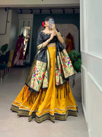 Load image into Gallery viewer, Black Color Blouse with Yellow Color Lehenga With Black Dupatta Heavy Zari Weaving Work , Vichitra Silk Black Langa Davani set includes a stitched lehenga made from Vichitra silk with a Paithani lace border, fitting up to a 42-inch waist with a drawstring and zip closure. The unstitched jacquard silk blouse features handwork and measures 1 meter. The jacquard silk dupatta showcases zari weaving with tassels and is 2.5 meters long. The set offers a complete traditional look with quality fabrics pure .
