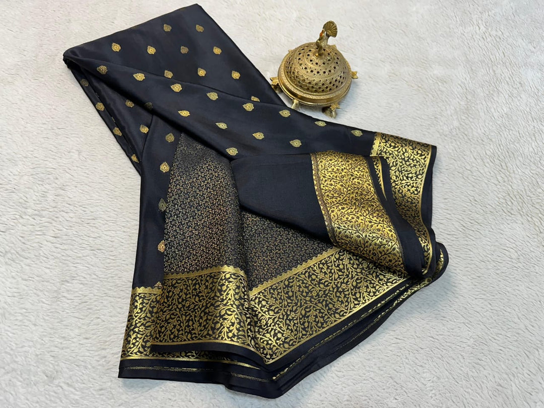 Black Mysore Silk Sarees With Price and Online Shopping Price Under 1500 . this Fabric So Cool nd Softy Model Collcetion woman Use This fabric and Black Saree Color With Gold Zari Weaving Work adn Rajavadi Small Pattern and salari design with rich pallu . This Fabric Traditional Look 2024-25 .