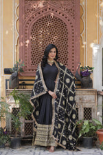 Load image into Gallery viewer, Black embroidered gown with golden sequins , Black star georgette gown for evening wear
Black full sleeve gown with lace dupatta , Elegant black gown for receptions and parties , Black ethnic gown with fancy V-neck .
