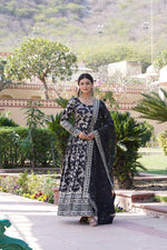 Load image into Gallery viewer, Black Viscose Dyable Jacquard Gowns With Price and Online Shopping Prices Under 2500 . Elevate your style with this embroidered Viscose Dyable Jacquard Gown. With a 3.5-meter flair, cotton lining, and a luxurious sequins dupatta, it's perfect for festive celebrations. Available in four stunning colors .