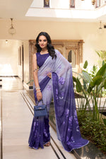 Load image into Gallery viewer, Blue floral print marble saree with lace border , Lightweight blue saree for daily wear , Casual blue printed saree with blouse , Trendy blue weightless saree for women, Elegant blue saree in marble fabric ,
Printed blue saree with designer lace edging , Blue saree with floral pattern and soft texture , Simple blue saree for casual functions
Sky blue-toned saree in lightweight material ,Affordable blue marble saree for gifting , Blue saree for festive and formal use .
