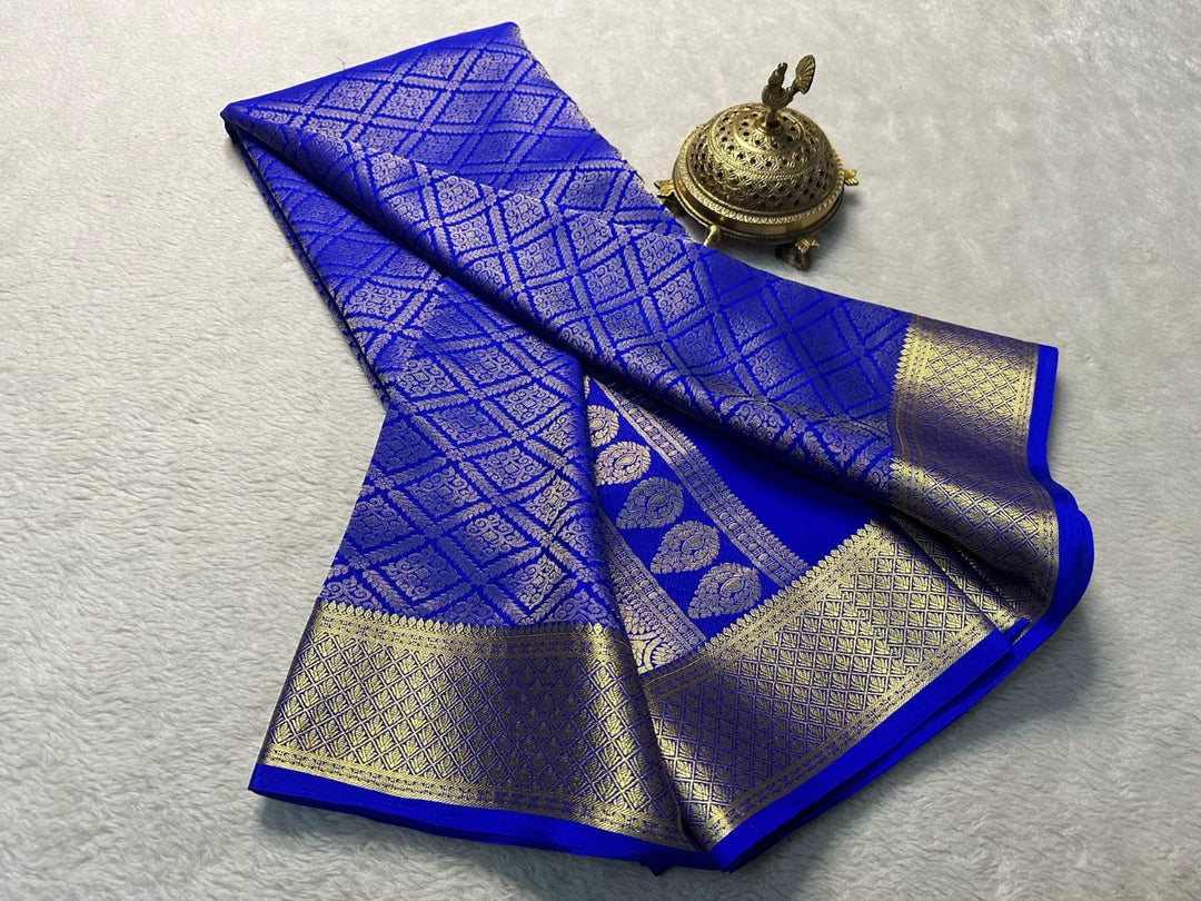 Pure Royal Blue Mysore silk sarees with price and online shopping price under 1500 . this saree mysore silk saree for weddings and  Gold fully zari weaving working all over saree most popular saree 2024-25 .