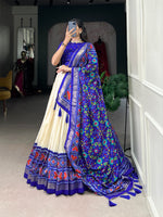 Load image into Gallery viewer, Shop the elegant Blue Tussar Silk Patola Print Lehenga online , Blue Patola Print Lehenga with tassels and canvas stitching , Stunning Blue lehenga with matching Patola print dupatta , Premium Blue Tussar Silk lehenga for festive occasions , Ethnic Blue lehenga with Gotta Patti lace border .
