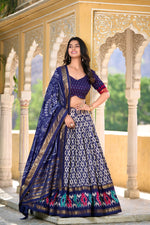 Load image into Gallery viewer, Blue Tussar Silk Dhavani Set , Langa Voni and Davani Set WIth Price and Online Shopping Price Under 2000 . Floral luxury with this Tussar Silk Lehenga Set. Stitched lehenga with can-can, micro cotton lining, unstitched blouse, and a tassel-adorned dupatta make it the perfect festive wear .