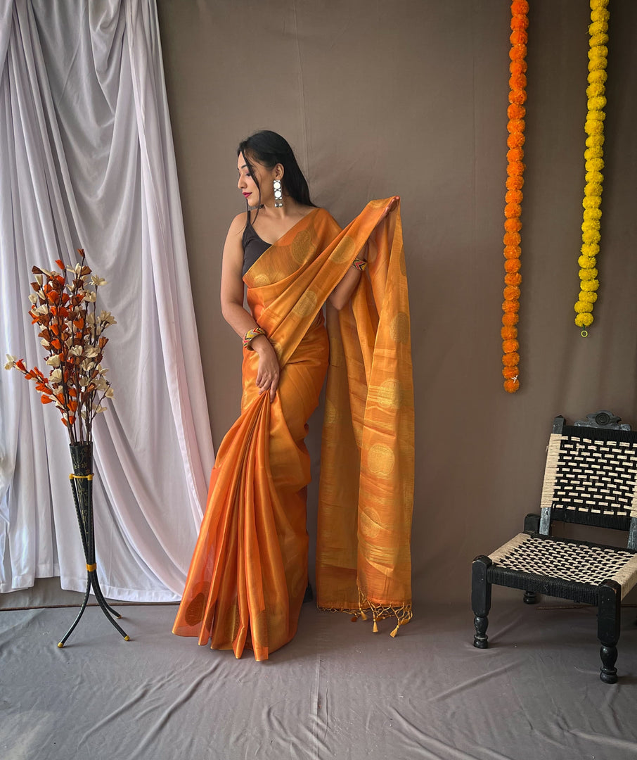 Discover the elegance of Orange Tissue Silk Sarees, crafted with pure silk and intricate weaving. Shop lightweight, handwoven sarees for weddings and festive occasions.