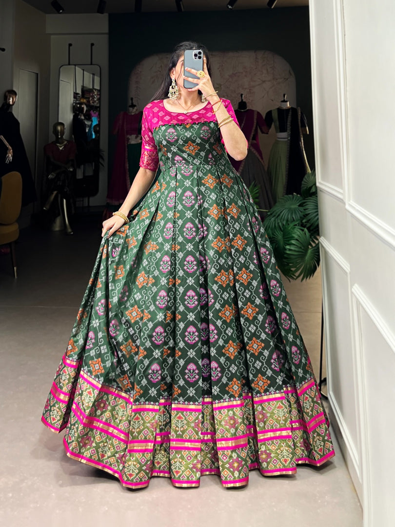 Dark Green With Rani Color Jacquard Silk Gown With Price and Online Shopping Price Under 2000 . this stunning Jacquard Silk Patola Print Gown. Designed with a 4 -meter flair, full-length cotton lining, and adjustable sizing, it's ideal for celebrations and Any Festival .