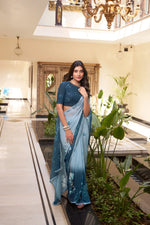 Load image into Gallery viewer, Dark sky marble saree with floral prints , Lightweight dark sky blue saree with lace , Trendy floral saree in dark sky color , Soft weightless dark sky saree for casual wear , Elegant printed saree in dark sky tone , Designer dark sky saree with contrast blouse , Floral motif saree in dark sky hue , Dark sky saree with delicate lace border , Festive-ready dark sky printed saree , Subtle dark sky saree for daily use .