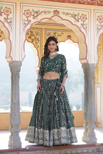 Load image into Gallery viewer, Rama Color Half Saree Set features a full-stitched lehenga made from pure viscose jacquard with embroidered sequins and a chain with dori latkan closure. The unstitched blouse is crafted from faux blooming fabric with sequined embroidery. The set includes a 2.3-meter dupatta with sequined and cut-work details. Available in Rani, Green, and Wine colors, it blends traditional style with elegant detailing.