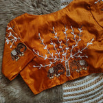 Load image into Gallery viewer, Dark Yellow Or Orange Haka Silk Stitched Blouse With Price Under 1500 . Shop this premium stitched blouse in haka silk fabric. Features 10-inch sleeves, padded design for added comfort, and a 15-inch height for a perfect fit .