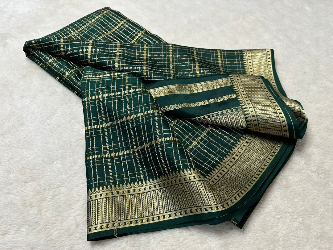 Denisha Mysore Silk Saree exemplifies traditional Indian craftsmanship with its exquisite Zari weaving details. Crafted from premium Mysore Silk, renowned for its lightweight feel and natural Saree.