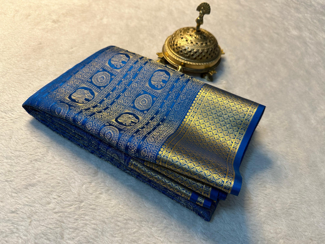 Elevate your ethnic wardrobe with our exquisite Rutika Mysore Silk Saree. Crafted from premium Mysore silk known for its lightweight feel and lustrous appearance, this saree features intricate zari weaving that adds a touch of traditional elegance.