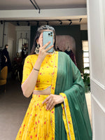 Load image into Gallery viewer, ✨ Step Into Elegance with this Beautifully Designed Tussar Silk Lehenga Set. Featuring Floral Prints, a Pearl Lace Border, and a lightweight Star Georgette Dupatta, this outfit is ideal for Weddings, Festive Celebrations, and Special Occasions.