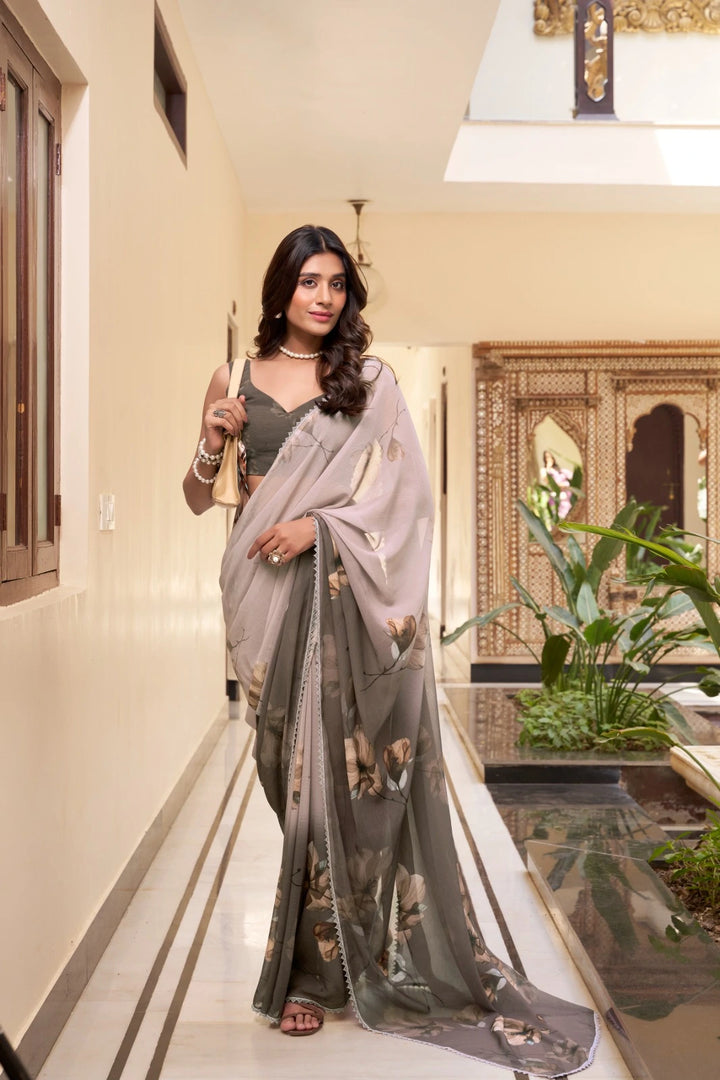 Elegant gray floral printed marble saree , Lightweight gray saree with lace border , Soft gray saree with flower motifs , Stylish gray saree for everyday wear , Gray weightless saree for working women , Printed gray saree with matching blouse , 
Casual gray saree in marble fabric , Designer lace border gray saree , Gray saree for festive and formal wear .
