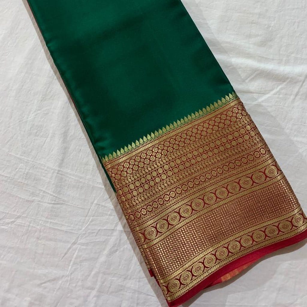 Green Semi-Mysore Silk Saree For Weddings and Party wear Collection and Gold Zari Weaving And Border Silk Gold Rich pallu . Traditional Look For Party Wear Collcetion and Mainly Manufacturing MySore State in Karnataka .