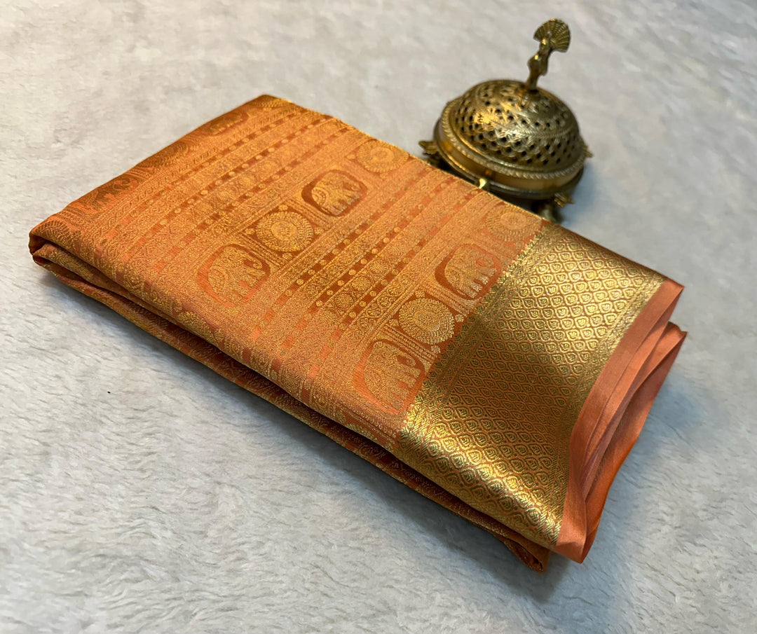 Light orange Mysore silk saree , Soft orange zari saree for women , 
Elegant orange festive wear saree , 
Light orange traditional silk saree , 
Zari weaving saree in orange tone , 
Light orange silk saree for puja , Subtle orange saree with blouse , 
Light orange Mysore saree for gifting , Orange wedding saree in silk , Light orange party wear silk saree .