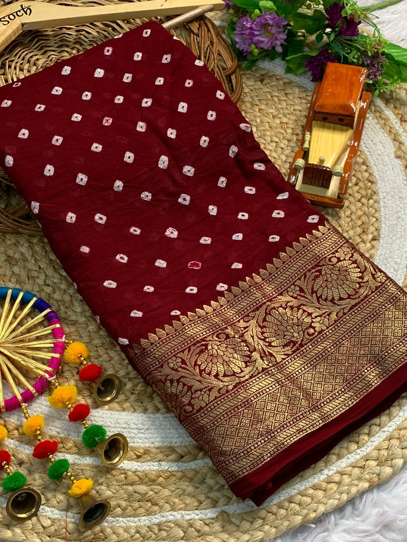 Maroon Cotton Silk Sarees With Price and Gold Zari Weaving Work and this Fabric Fully Gold Zari Weaving Women from cities like Kolkata, Varanasi, Lucknow, and across India who seek versatile ethnic wear for every occasion .