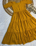 Load image into Gallery viewer, Mustard Yellow Color Cotton Hakoba Fully Fair and Plain Gown . Summer special yellow gown with flared cotton layers , Trendy yellow mini frock in soft Hakoba cotton , Elegant yellow 3-layer gown with stylish side detailing , Yellow designer gown with rope tie-up and full lining .