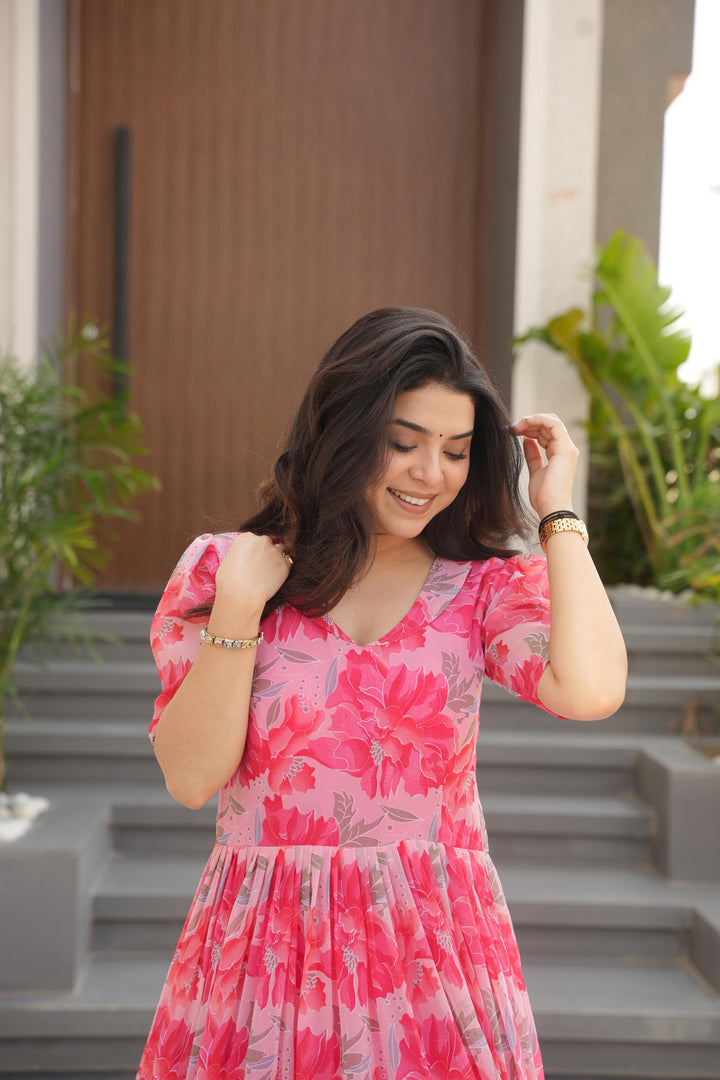 Peach or Pink Printed faux georgette gown (56" length, 12m flair) with cotton lining, half sleeves and fancy V-neck. Fully stitched Gown , Traditional Look 2025-26 .