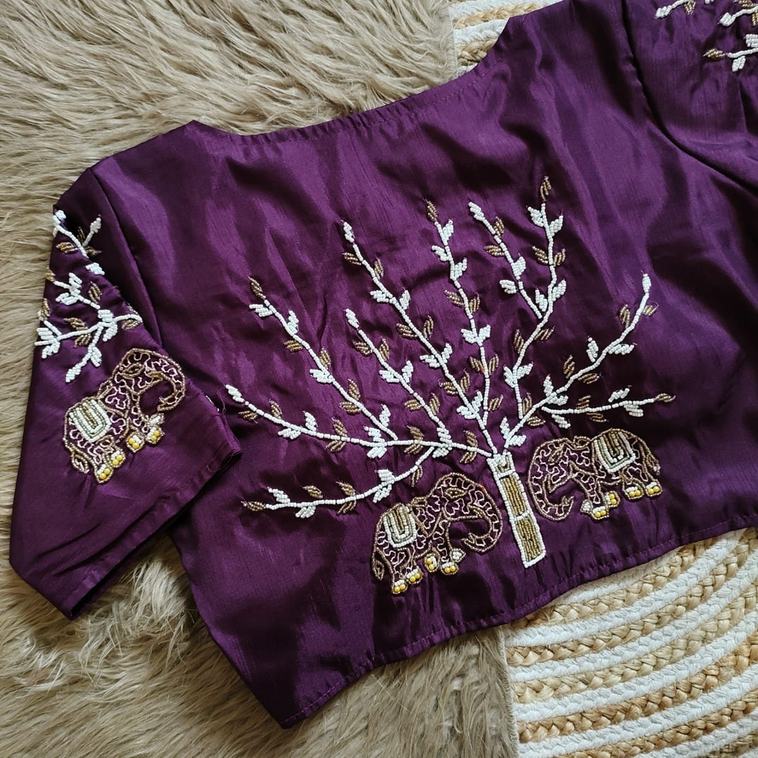Purple Haka Silk Stitched Blouse With Price and Online Shopping Price Under 1500. this Stitched Blouse Sleeve 10 Inches and Best For Weddings Wear Collection . this Fabric Haka Silk Fabric Pure and Silky Fabric Purple  Color Embroidery work and Elephant Designs .