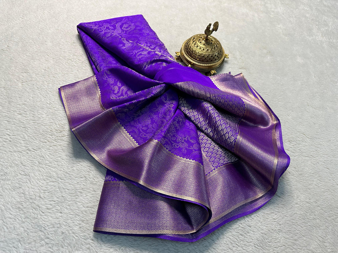 Purple Mysore Silk Sarees With Price And Online Shopping Price under 1500 . This Fabric Smooth and Zari weaving Work . This Fabric Mainly Manufacturing of Mysore District in Karnataka of India . This Fabric Mysore Silk Blue saree Price Under  1500 .