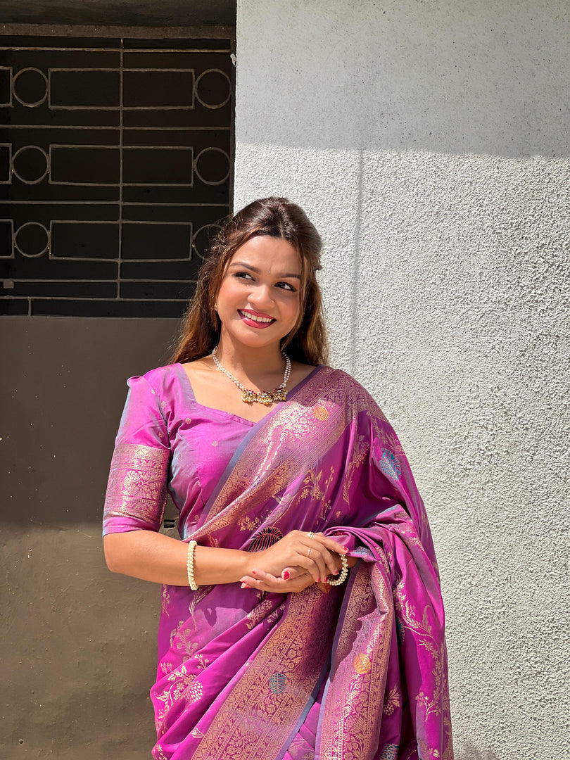 Lavender Soft Banarasi Silk Saree . Made from pure silk, the saree has a smooth, enhancing its richness. The silk used in Soft Banarasi sarees is typically Katan silk, a fine variety of silk that feels luxurious against the skin and drapes beautifully.