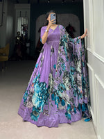 Load image into Gallery viewer, Purple Tussar Silk Anarkali With Price and Online best Choise For Shopping Price Under 2000 . this Fabric Tussar Silk Outfit – Gown with Matching Dupatta and Elegant floral printed gown in Tussar silk with full lining and lace touch-up. Paired with a floral dupatta enhanced by Gotta Patti lace and tassels. Perfect for festive events.