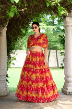 Load image into Gallery viewer, Ready-to-wear red lehenga with floral charm and rich color , Shop full-stitched red lehenga with pearl blouse online , Statement-making red lehenga with traditional flair , Elegant red chiffon lehenga set for Indian ceremonies , Flowing red lehenga with zip closure and printed blouse .