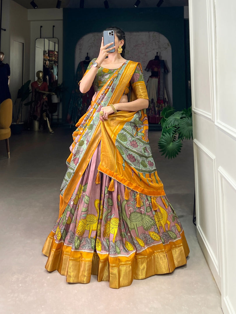 Rose Gold and Pure Gold Color Dola Silk Langa Voni , Davani Set , Half-Saree and Dhavani Sets With Price and Online Shopping Price Under 2000 . Make a statement with this Kalamkari Lehenga crafted in Dola Silk. Includes a flared lehenga, printed blouse, and a Zari-bordered dupatta with tassels. Perfect for weddings and festive celebrations . Traditional Look 2024-25 , 2025-26 .