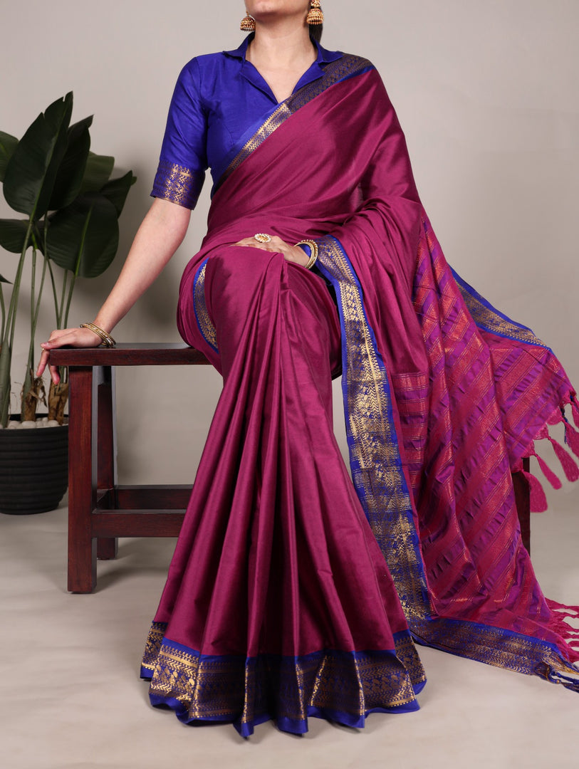 Luxurious wine color aura silk saree , Wine silk saree with zari weaving work , Premium wine saree for festive elegance , Deep wine tone saree with golden zari detail , Wedding special wine silk saree with shine .
