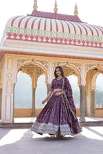 Load image into Gallery viewer, Wine lehenga set with embroidered blouse and net dupatta , Trending Wine lehenga for bridal and festive collections , Party-perfect Wine lehenga with a flattering silhouette , Gorgeous Wine color lehenga in rich viscose fabric , Celebrate in style with this Wine wedding lehenga , Shop Wine embroidered lehenga for modern ethnic wear.