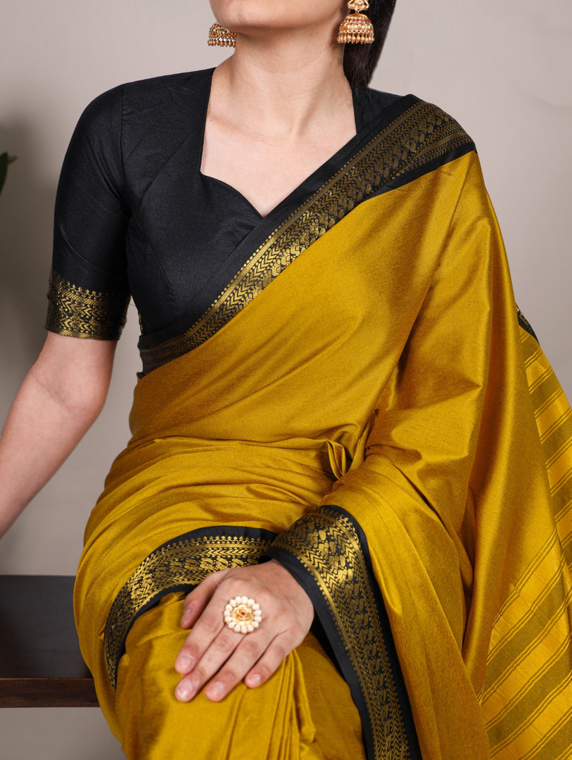 Premium silk saree in vibrant yellow shade , Yellow aura silk saree with zari pallu , Haldi-perfect yellow silk saree with sheen , Yellow saree with ethnic woven detailing , Must-have yellow silk saree for festive wardrobe .