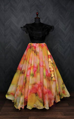 Load image into Gallery viewer, Enhance your wardrobe with this elegant full-stitched lehenga and blouse set. Crafted from soft organza with rich digital prints and faux georgette, featuring a stunning frill blouse and a 7-meter flair lehenga. Black Color Blouse Plain , Trending Look For 2025-26 . this Fabric So Soft Organza For Weddings Best Wear Collection Price and Online Shopping Price Under 1000 .