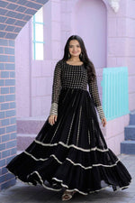 Load image into Gallery viewer, Black Faux Blooming Gown With Price and Online Shopping  Price Under 1500 . this Fabric Turn heads with this Faux Blooming Gown featuring elegant zari and sequins embroidery. Designed with a Round neck , and cotton lining, it’s perfect for any special occasion .

