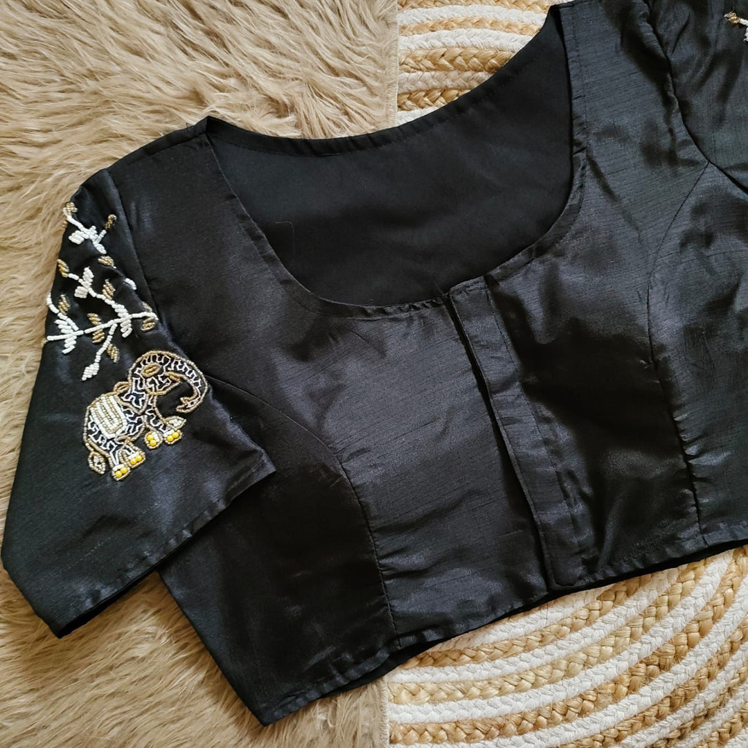 Black Haka Silk Stitched Blouse With Price and Online Shopping Price Under 1500 . This Fabric Black Color Haka Silk Stitched Blouse trees Embroidery work and Elephant Design and Sleeve 10 Inch and Height 15 Inch and Traditional Wear And Wedding Wear Collection , Traditional Look 2025-26 . 