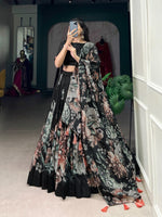Load image into Gallery viewer, Black wedding wear lehenga in premium Tussar silk , Floral print black lehenga for party and festive wear , Black Tussar lehenga with drawstring and side zip , Graceful black floral lehenga for haldi, mehendi, or evening events , Elegant stitched black lehenga for modern traditional looks .
