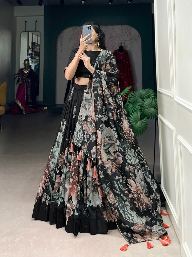 Black wedding wear lehenga in premium Tussar silk , Floral print black lehenga for party and festive wear , Black Tussar lehenga with drawstring and side zip , Graceful black floral lehenga for haldi, mehendi, or evening events , Elegant stitched black lehenga for modern traditional looks .