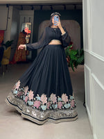 Load image into Gallery viewer, Elegant black georgette dhavani featuring a sequin and thread embroidered lehenga paired with a plain georgette top with lace border. Both pieces come pre-stitched.

