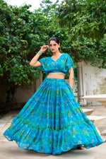 Load image into Gallery viewer, Blue Color Chiffon Langa Voni , Davani Set , Half-Saree and Dhavani Sets With Price and Online Shopping Price Under 2000 . Make a statement with this Floral Print Lehenga crafted in Chiffon. Includes a flared lehenga, printed blouse, and a zari-bordered dupatta with tassels. Perfect for weddings and festive celebrations . Traditional Look 2024-25 . 

