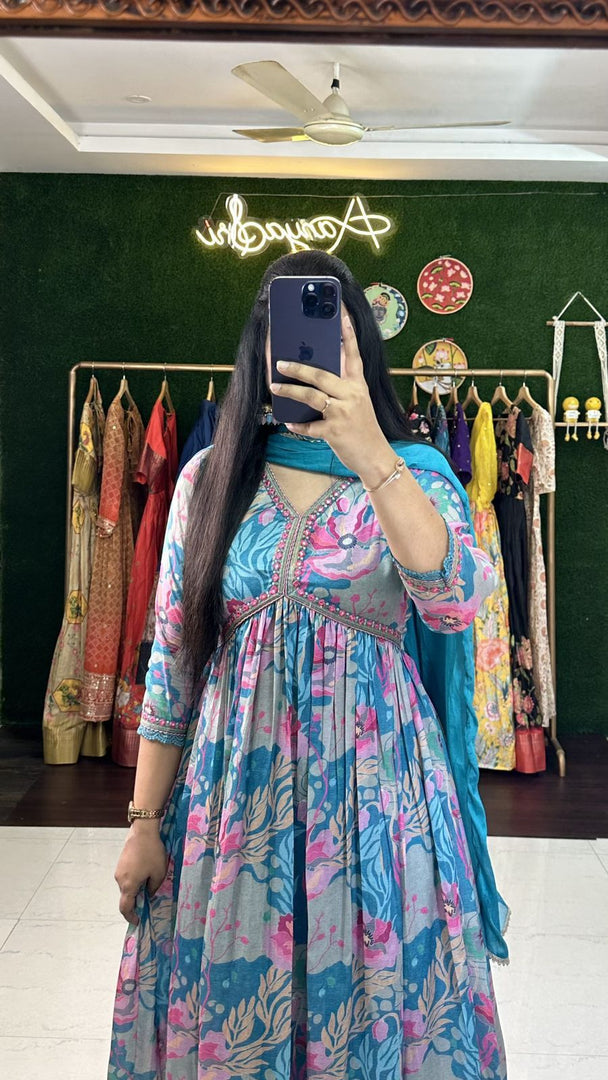 Blue printed Anarkali dress for casual to festive wear , Graceful blue Anarkali suit with puff half sleeves , Premium muslin Anarkali in royal blue color , Blue embroidery work Anarkali for special functions , 
V-neck blue Anarkali suit stitched to perfection . 