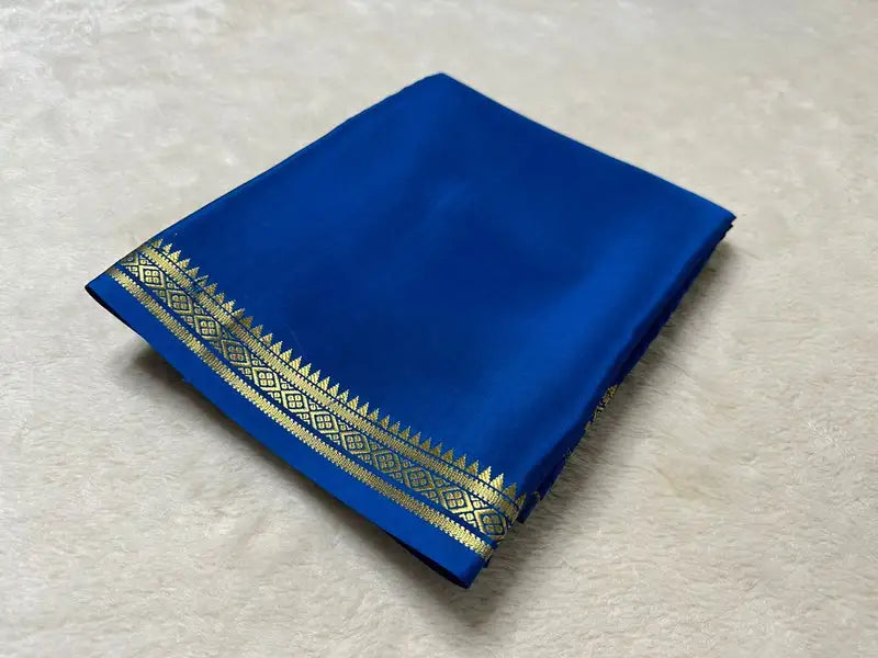 Semi-Mysore Silk Saree with zari work. 6.3m length. Includes blouse. Machine washable.
