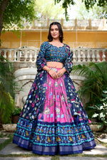 Load image into Gallery viewer, Blue Tussar Silk Dhavani Set , Langa Voni and Davani Set WIth Price and Online Shopping Price Under 2000 . Floral luxury with this Tussar Silk Lehenga Set. Stitched lehenga with can-can, micro cotton lining, unstitched blouse, and a tassel-adorned dupatta make it the perfect festive wear . 
