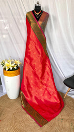 Load image into Gallery viewer, Striking red soft silk saree featuring exquisite Kanchipuram weaving work. Comes with a matching blouse. Perfect for weddings and grand occasions.

