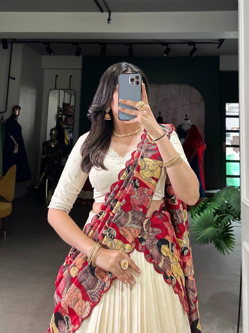 Experience elegance and sophistication with the Ekta Vichitra Silk Half-Saree | Davani Set | Shoppers Trend. Discover the impeccable craftsmanship of Vichitra Silk with hand-stitched sequins and thread embroidery, adorned with a Kalamkari print border. The drawstring and tassel closure adds a touch of luxury . 