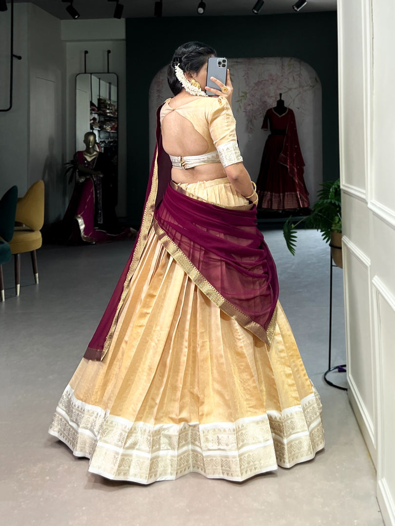 Elegant Kanchipuram Davani Set with zari-woven stitched lehenga (fits up to 42" waist), matching unstitched Kanchipuram blouse fabric, and lace-bordered georgette dupatta. Complete traditional ensemble with premium materials.

