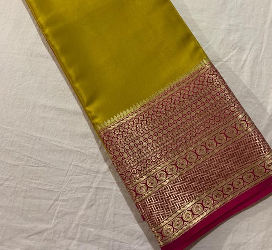 Mustard Yellow Semi-Mysore Silk Saree price with Golden Zari Weaving And Border Red pattu And Gold Zari . Pure Semi-Mysore Silk Saree Tradition Of Karnataka . Mainly manufacturing Of this Type Of Pure Mysore Silk Saree In Mysore District In Karnataka , India. 
