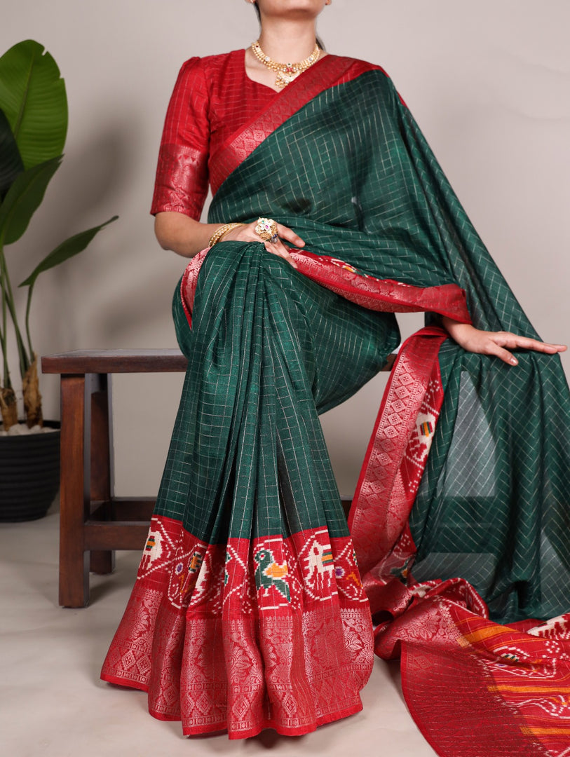 Dark Green Tussar Checks Sarees With Price and Online Shopping Price Under 1000 . Discover the elegance of Tussar Chex sarees featuring Patola print and a weaving work border. Includes an unstitched matching blouse for a complete look. Saree length: 5.5 meters . Traditional look 2025-26 . 