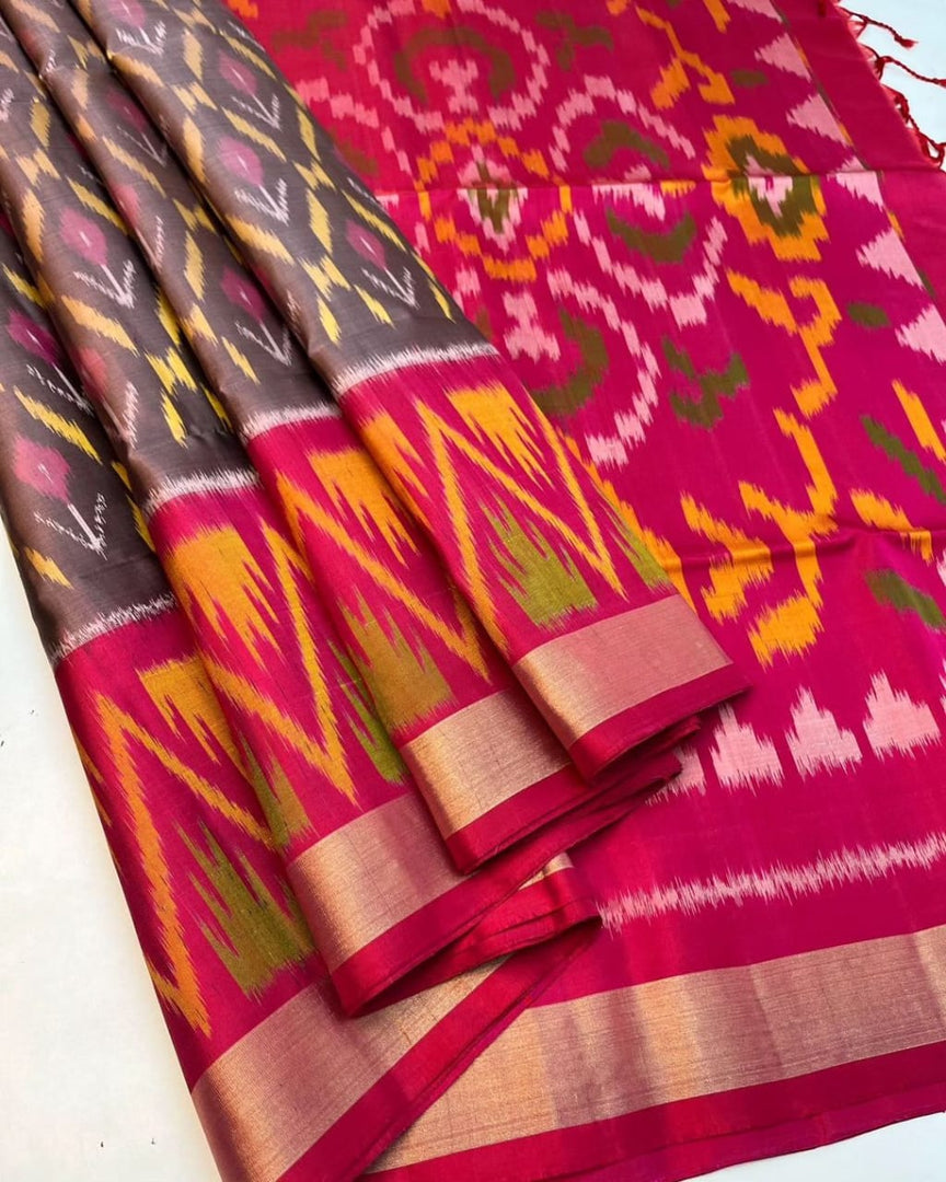 Dark Maroon Ikkat dola silk sarees with price and online shopping Price under 1000 . This Fabric ikkat Dolla Silk Saree Crafted from premium dolla silk fabric, this saree is lightweight, lustrous, and perfect for festive occasions, weddings, and cultural celebrations.