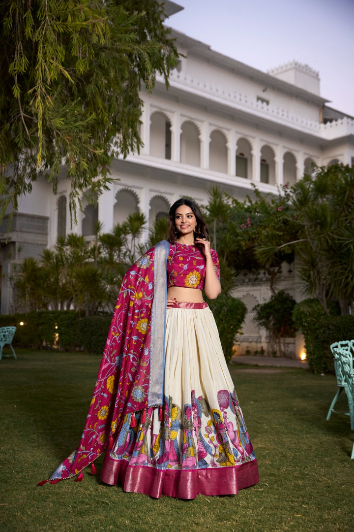 Dark Pink and Cream Dola Silk Dhavani Set , Langa Voni , Davani Set and Half-Sarees With Price and Online Best Online shopping Price Under 2000. Step into elegance with this Dola Silk Kalamkari Lehenga Set. Featuring a zari weaving border, printed design, and a matching dupatta with tassels, this ensemble is perfect for festive occasions . 