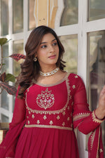 Load image into Gallery viewer, Dark Pink Color With Embroidery Faux Blooming Georgette Gown With Price and Online Shopping Price Under 2500 . Step into style with this Dark Pink Gown in Faux Blooming Georgette. Featuring heavy Rich Sequins Embroidered work, a stitched can-can design, and a Faux Blooming Georgette With Attractive lace and embroidered work, it’s ideal for weddings and celebrations . 
