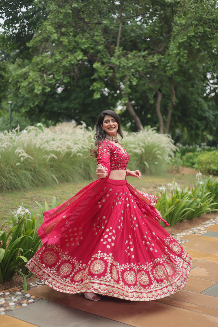 Rani Pink Rangoli Silk Half Saree features a fully stitched lehenga made from Rangoli Silk with heavy sequins and thread embroidery, measuring 42" in length and waist, with a 3.5-meter flair and zip closure with dori latkan. The blouse fabric is unstitched Rangoli Silk with matching embroidery, and the dupatta is 2.2 meters long with a designer lace border .